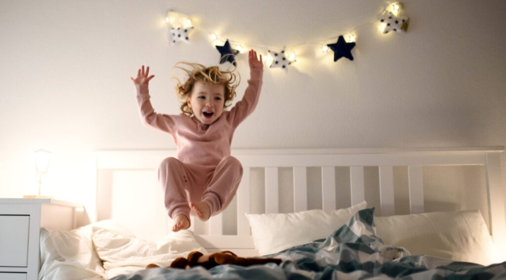 Child jumping on the bed