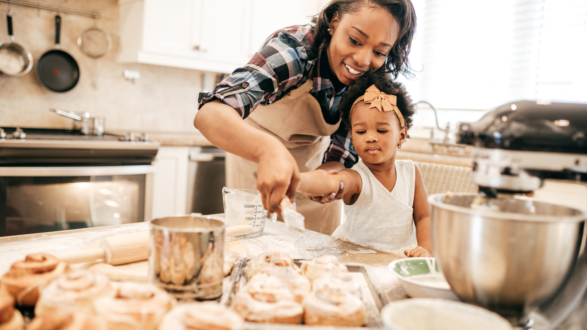 mom baking with their toddler