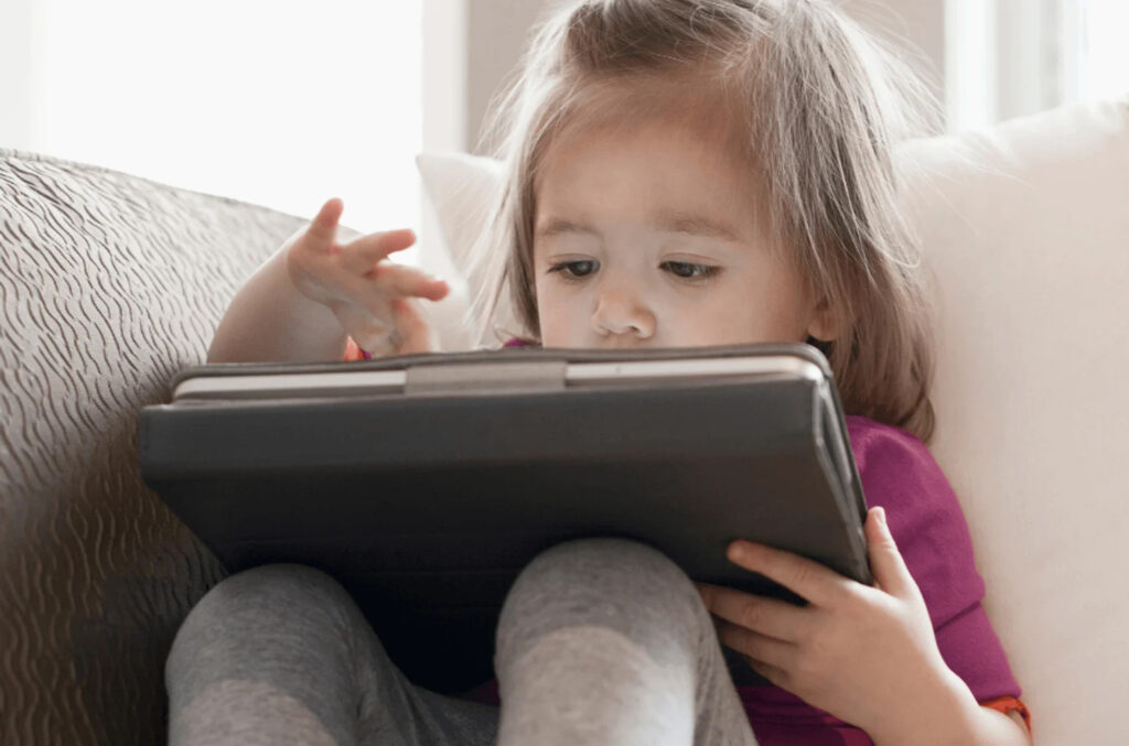 toddler girl on ipad